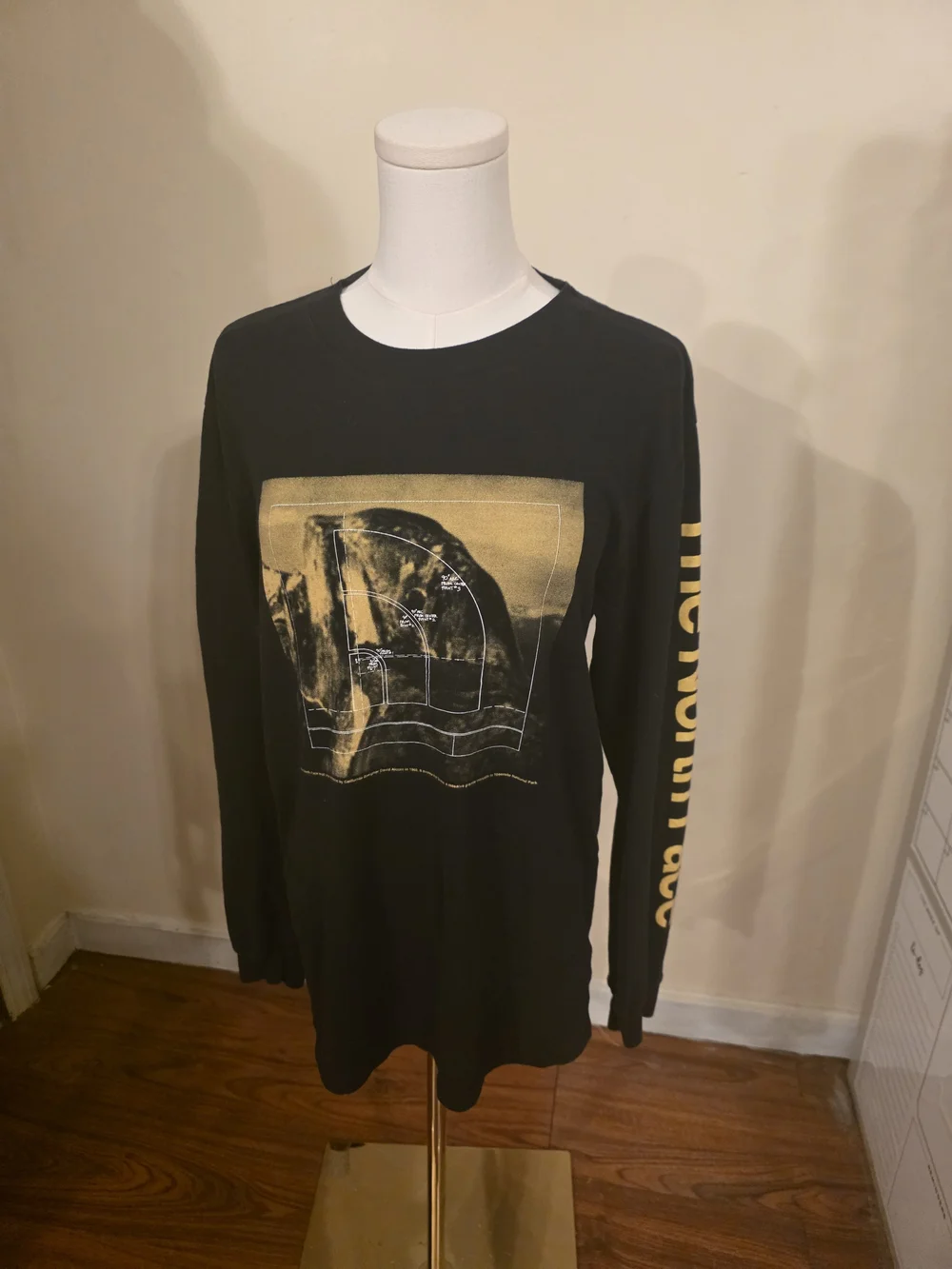 The North Face Black Long-Sleeve Tee with Yellow Graphic